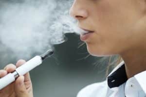 closeup of woman smoking electronic cigarette outd 2021 08 26 15 46 09 utc