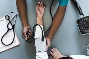 nurse measuring patient blood pressure 2021 08 29 18 27 38 utc 1